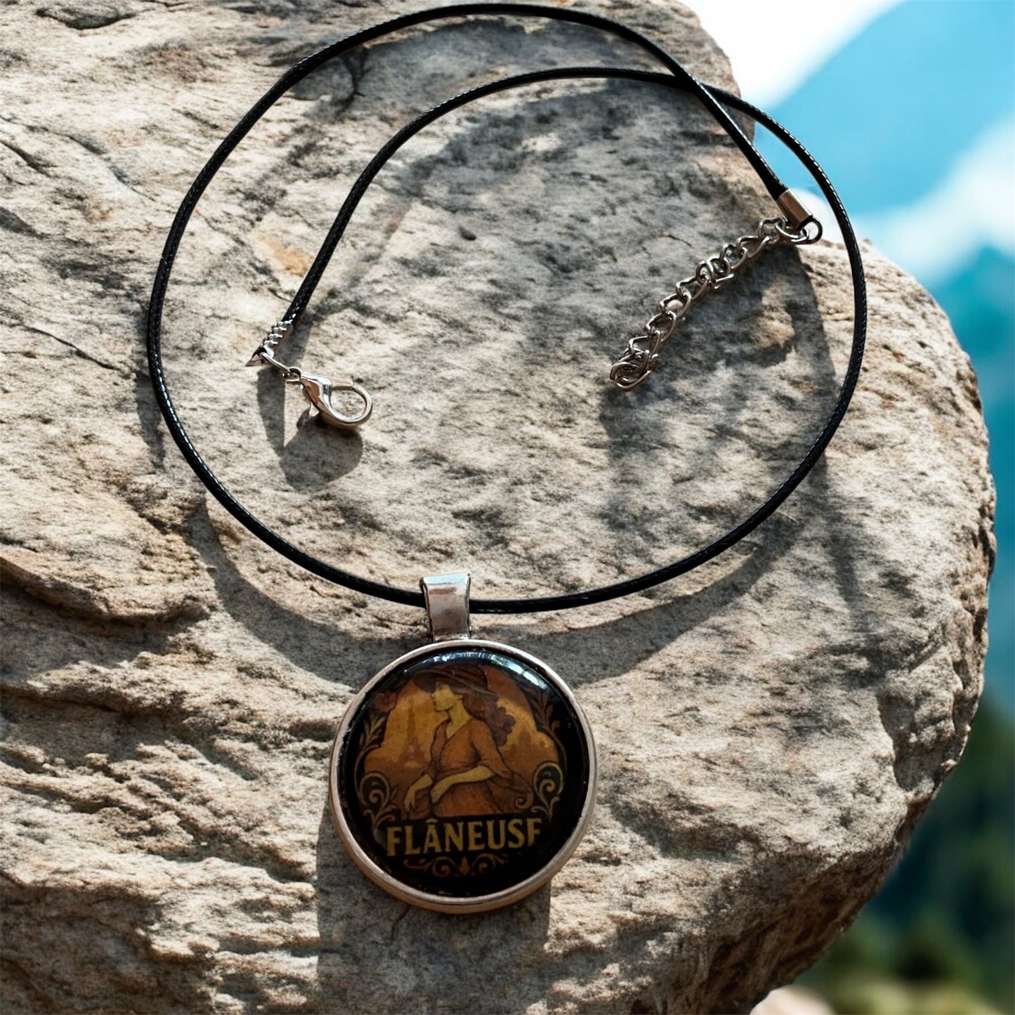 “Flâneuse” pendant with black cord necklace