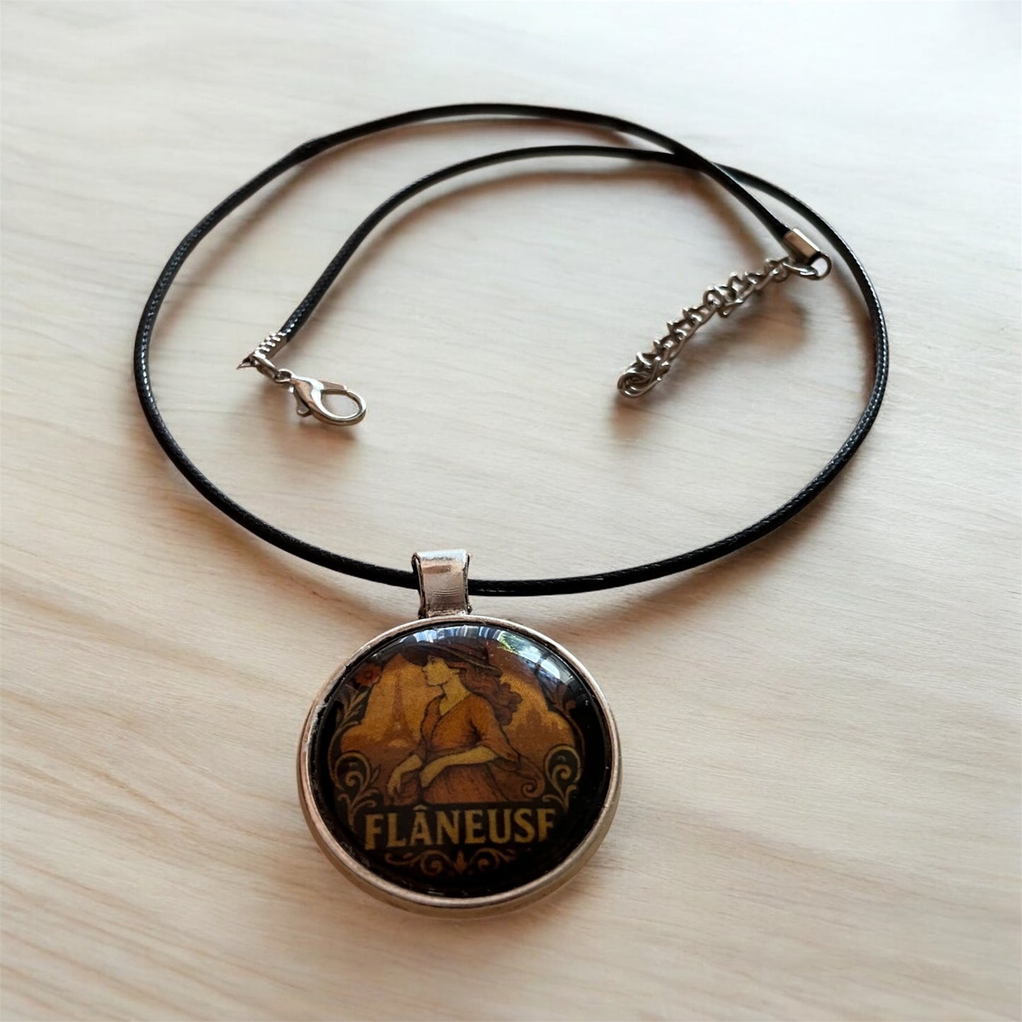 “Flâneuse” pendant with black cord necklace