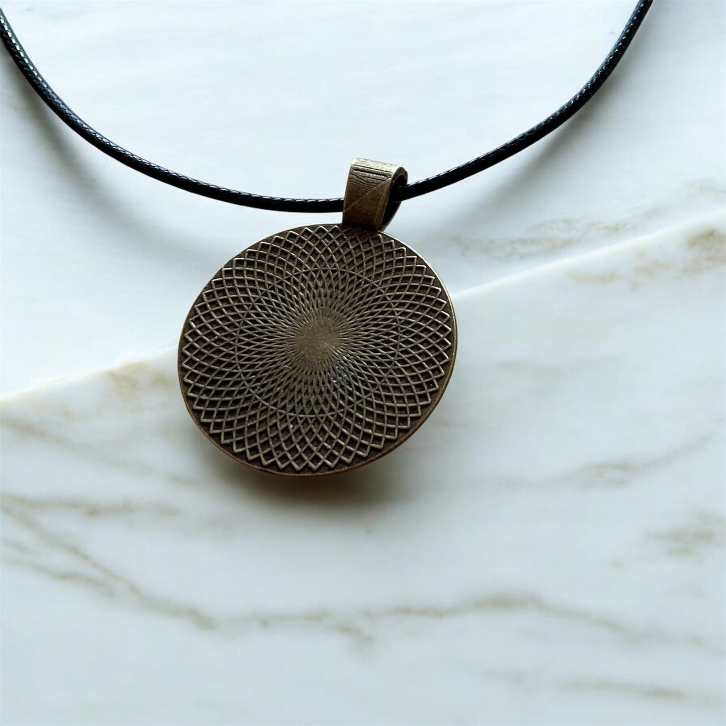 Cheeky “Je m’en fous” pendant with black cord necklace