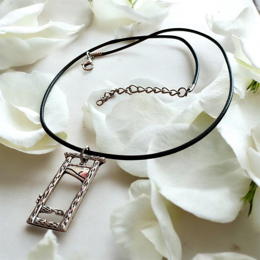 Silver plated guillotine pendant with black necklace