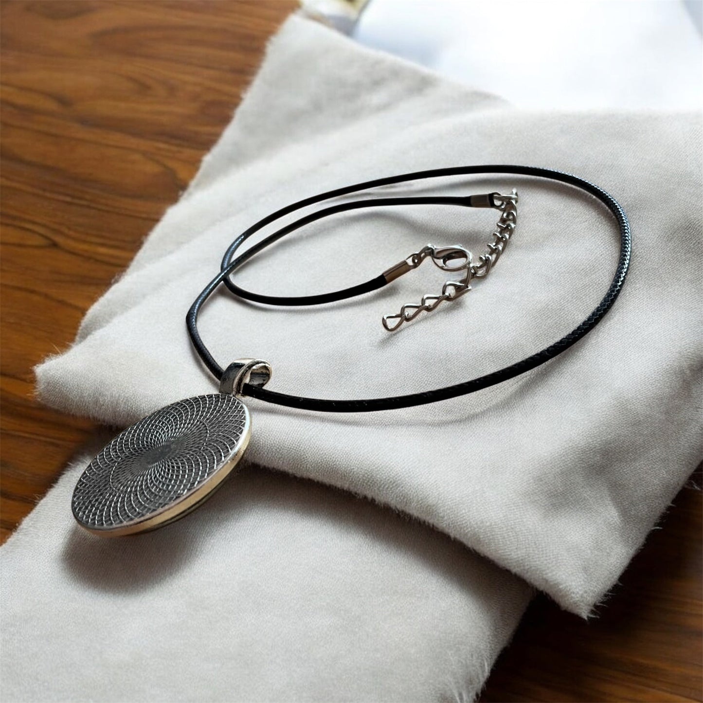 “Flâneuse” pendant with black cord necklace