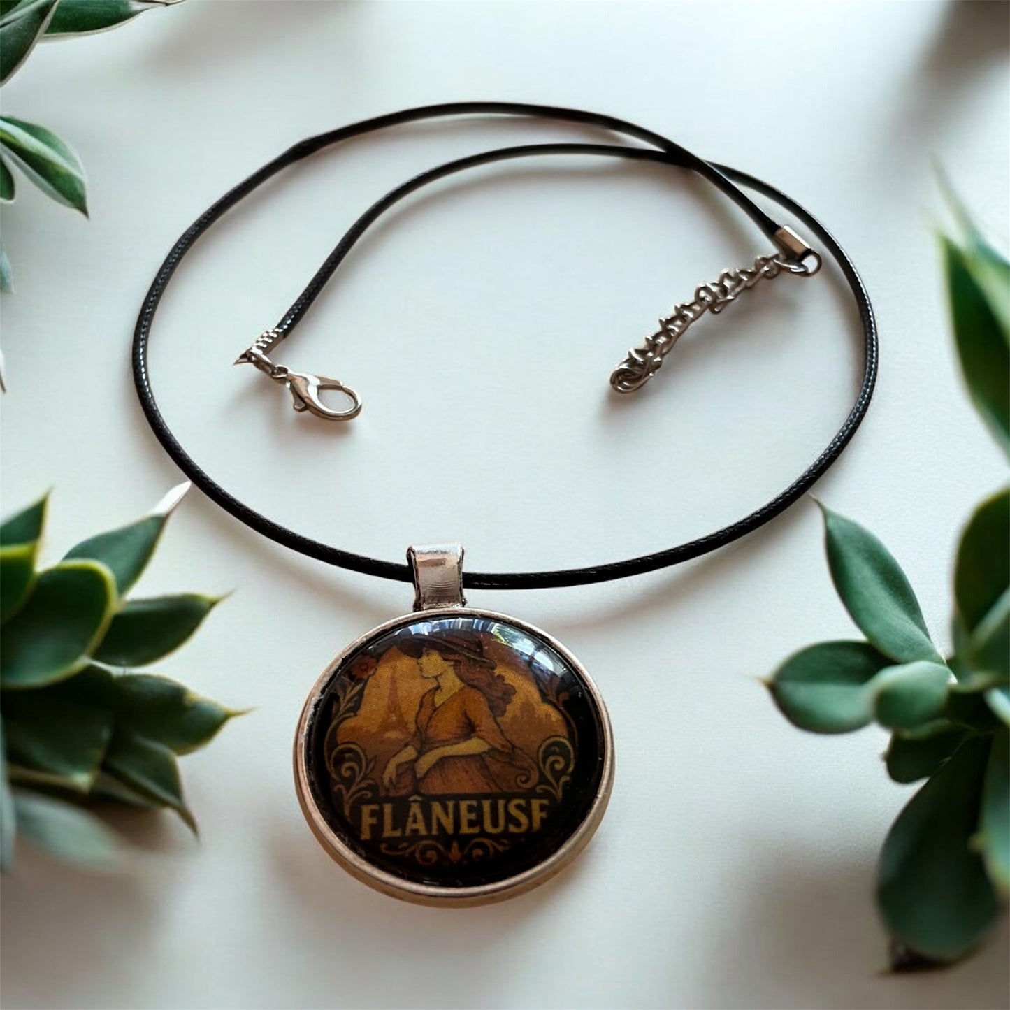 “Flâneuse” pendant with black cord necklace