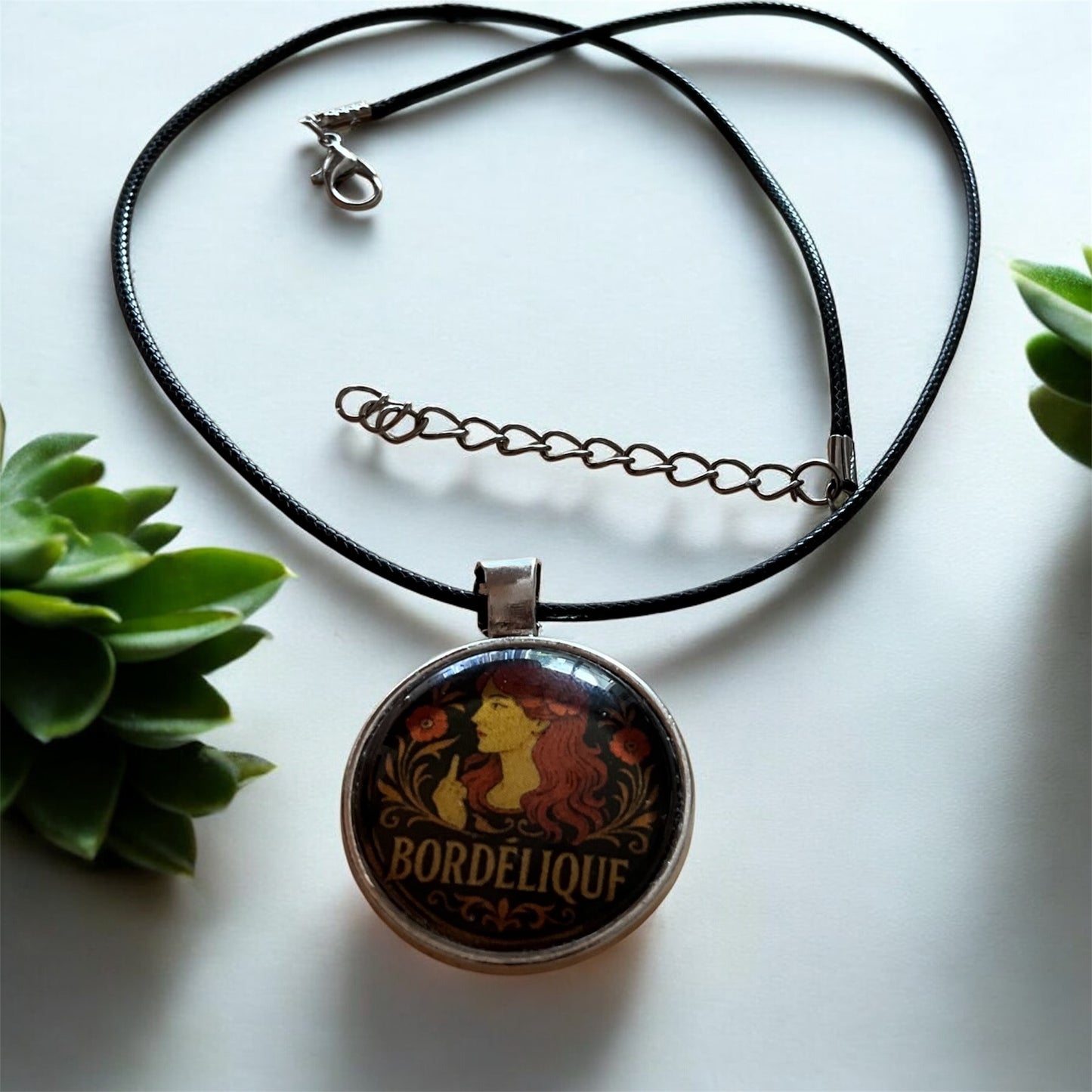 Sassy “Bordélique” pendant with black cord necklace