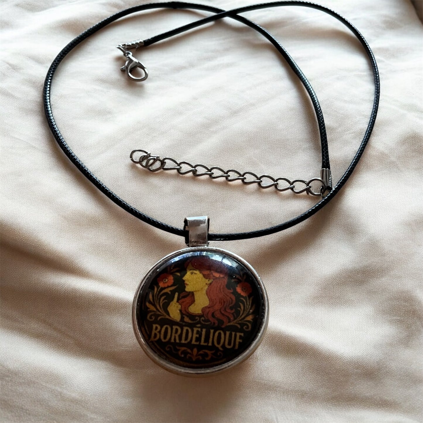 Sassy “Bordélique” pendant with black cord necklace