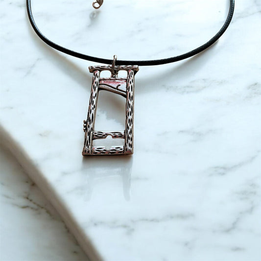 Silver plated guillotine pendant with black necklace